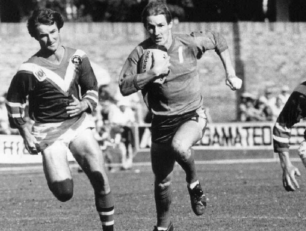 ON FIRE: Mal Eames (left) and Mark Browne (right) move in on an opposition player in the golden years of the Warwick Cowboys. ON FIRE: Mal Eames (left) and Mark Browne (right) move in on an opposition player in the golden years of the Warwick Cowboys.