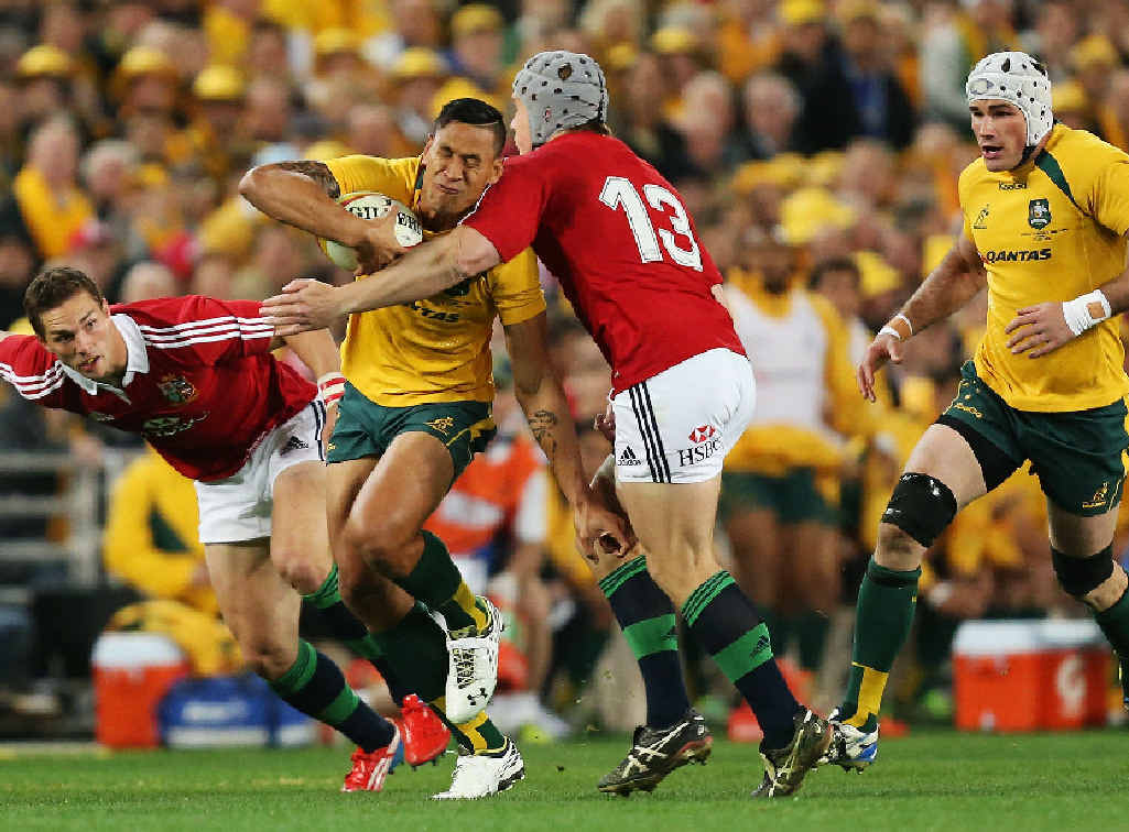 GOTCHA: The Wallabies’ Israel Folau feels the pain as the Lions defence closes in last night. GOTCHA: The Wallabies’ Israel Folau feels the pain as the Lions defence closes in last night.
