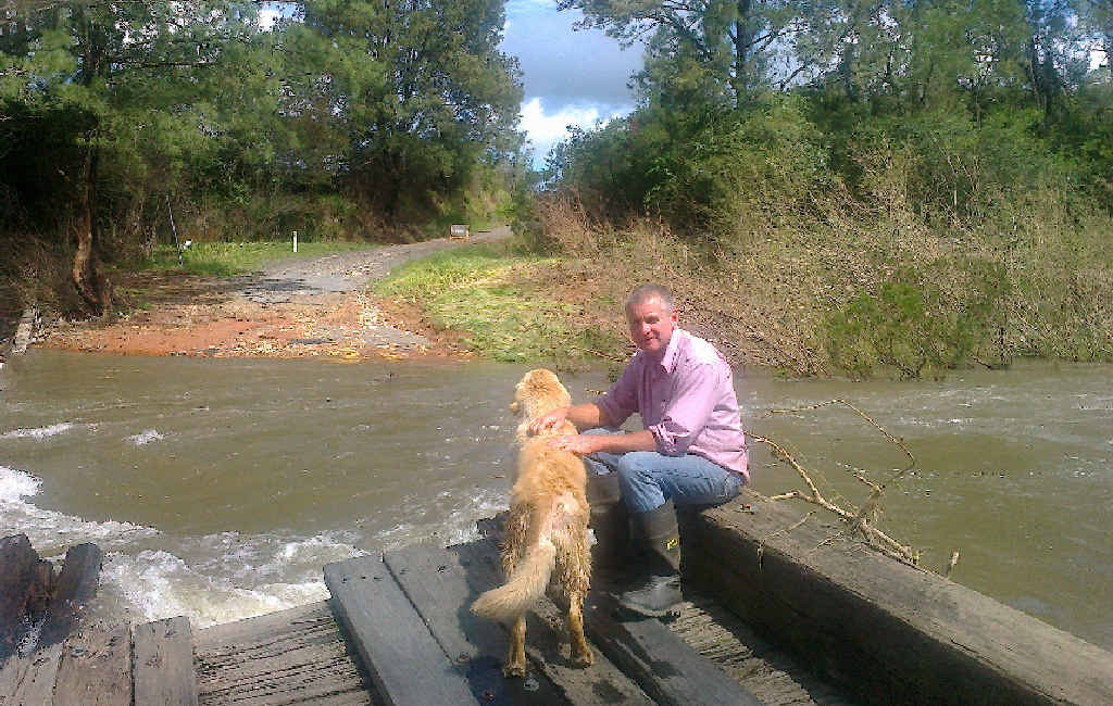 SLOW PROCESS: Stuart Pearce at the Moonpar Bridge after it was washed away but before the pedestrian bridge was built. SLOW PROCESS: Stuart Pearce at the Moonpar Bridge after it was washed away but before the pedestrian bridge was built.