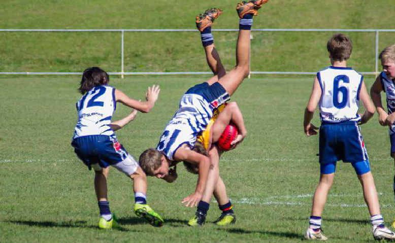  A Gympie Cats’ player goes head over heels in the game against Noosa.