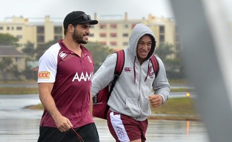 Queensland State of Origin team arrive at the Sunshine Coast Airport. Greg Inglis and Josh Papalii brave the rain. Photo: Warren Lynam / Sunshine Coast Daily Queensland State of Origin team arrive at the Sunshine Coast Airport. Greg Inglis and Josh Papalii brave the rain. Photo: Warren Lynam / Sunshine Coast Daily