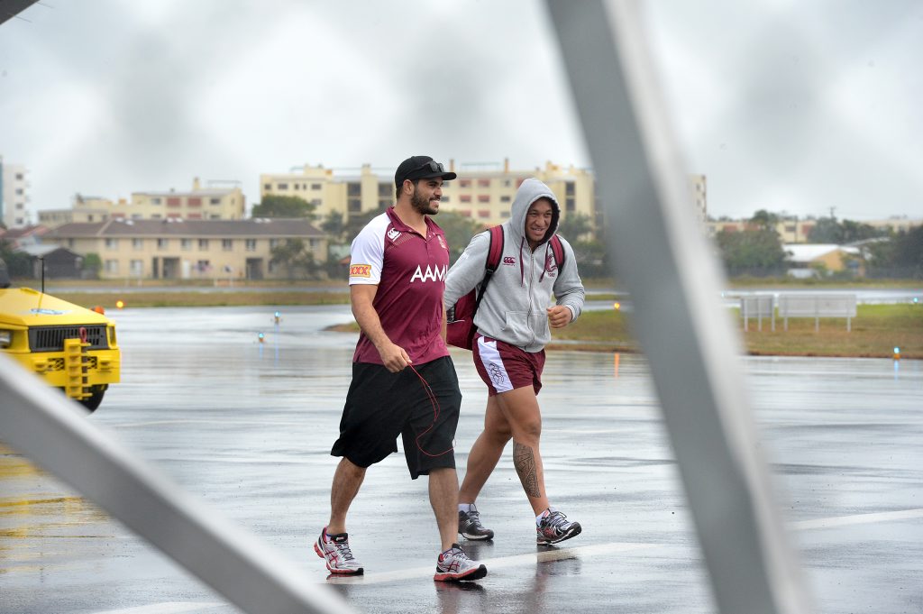 Queensland State of Origin team arrive at the Sunshine Coast Airport. Greg Inglis and Josh Papalii brave the rain. Photo: Warren Lynam / Sunshine Coast Daily Queensland State of Origin team arrive at the Sunshine Coast Airport. Greg Inglis and Josh Papalii brave the rain. Photo: Warren Lynam / Sunshine Coast Daily