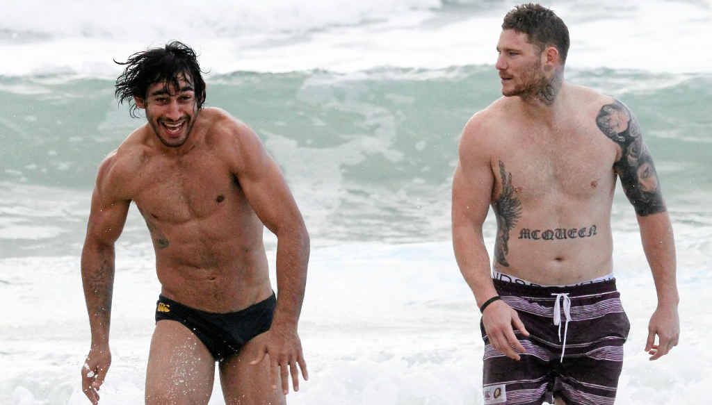 IN GOOD SHAPE: Johnathan Thurston and Maroons teammate Chris McQueen head back to shore at Yaroomba yesterday. IN GOOD SHAPE: Johnathan Thurston and Maroons teammate Chris McQueen head back to shore at Yaroomba yesterday.