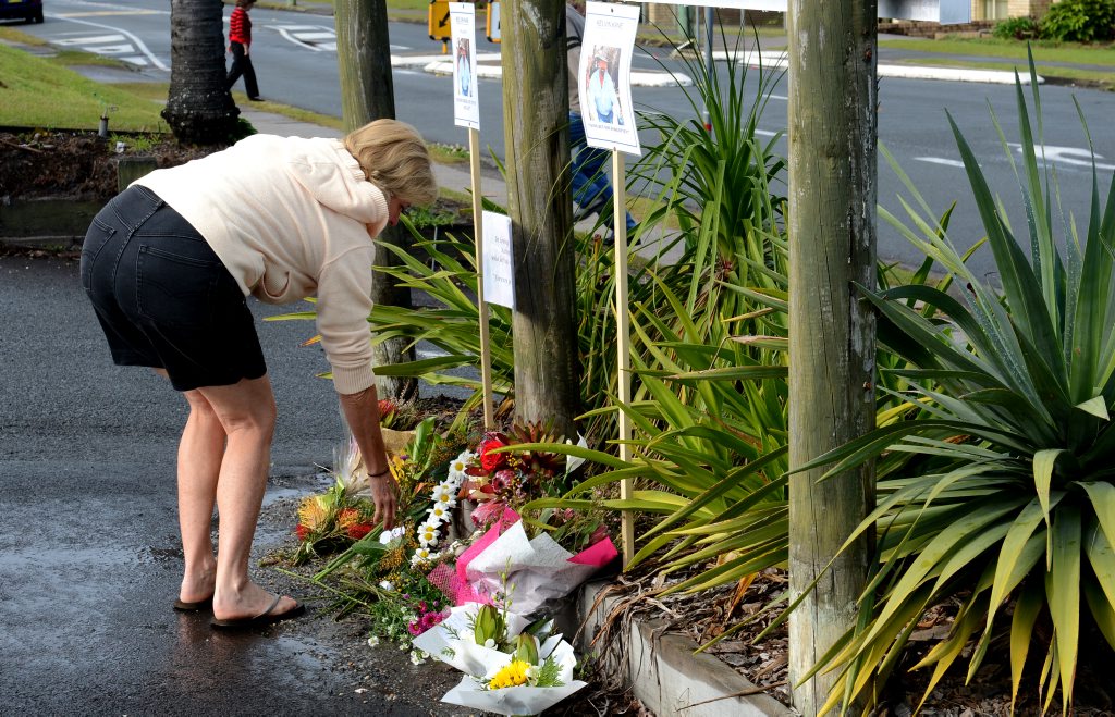 People laying wreaths for Kelvin Kane in the carpark Kingscliff. People laying wreaths for Kelvin Kane in the carpark Kingscliff.