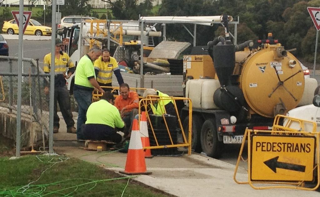 RUSH JOB: An NBN crew works furiously to make temporary repairs at Goodna. RUSH JOB: An NBN crew works furiously to make temporary repairs at Goodna.