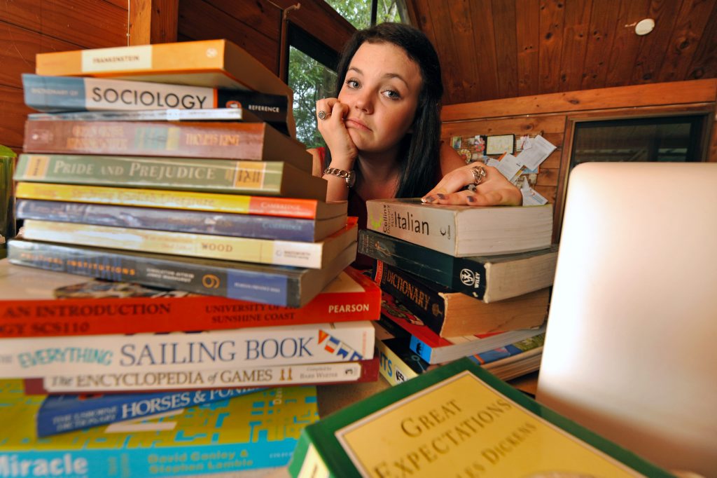 Yandina's Peta Wicks finds it hard juggling her university studies at USC with paid work at IGA supermarket. Yandina's Peta Wicks finds it hard juggling her university studies at USC with paid work at IGA supermarket.