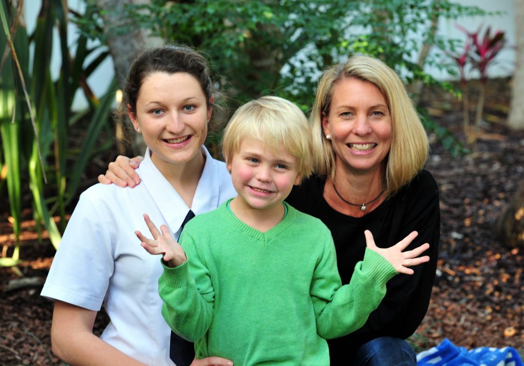 Image for sale: 5 year old Jesse Forsyth with his Mum Caroline (right) and his rescuer India O`Connor happily at home in Noosa after his big adventure.