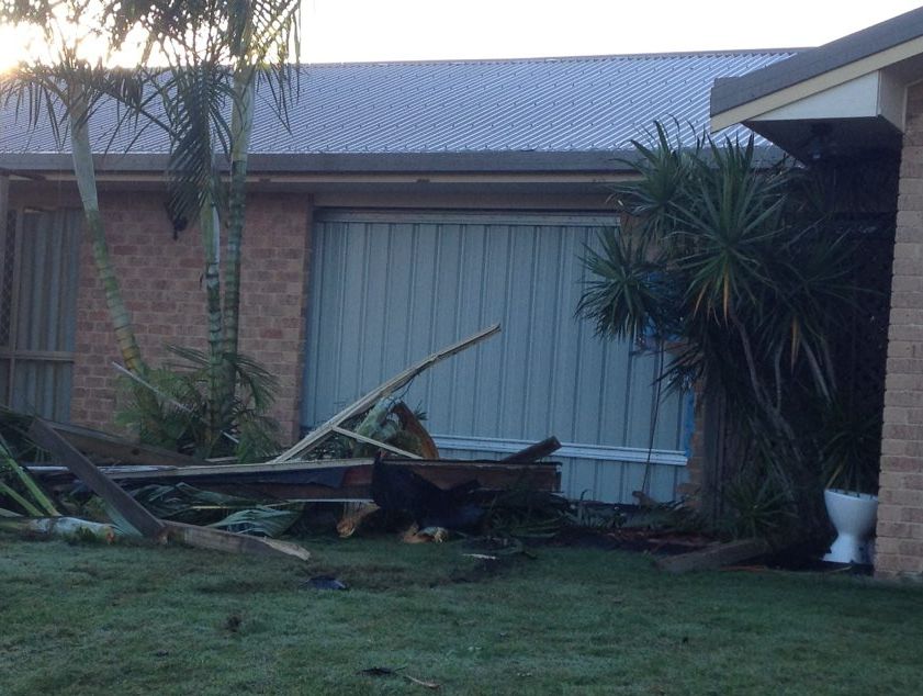The front of the Pialba house that a four-wheel drive crashed into has been boarded up. The front of the Pialba house that a four-wheel drive crashed into has been boarded up.