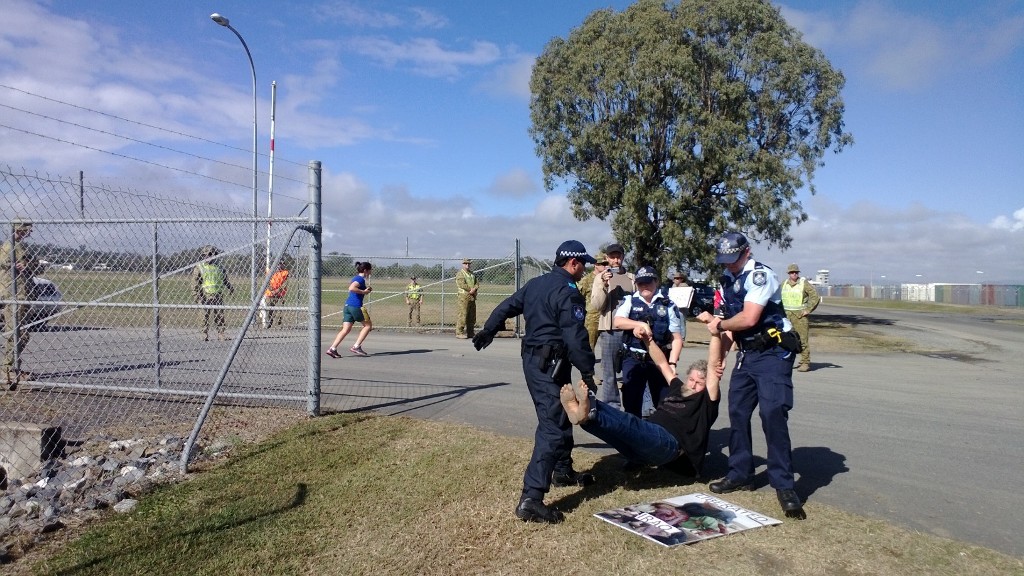 Jim Dowling being arrested outside Western Street Barracks in Rockhampton during Talisman Saber 2013. Jim Dowling being arrested outside Western Street Barracks in Rockhampton during Talisman Saber 2013.