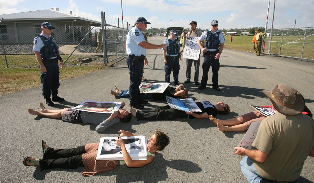 Anti-war protesters briefly blocked the entrance to Camp Rocky as Exercise Talisman Sabre ramps up. Photo: Chris Ison / The Morning Bulletin Anti-war protesters briefly blocked the entrance to Camp Rocky as Exercise Talisman Sabre ramps up. Photo: Chris Ison / The Morning Bulletin