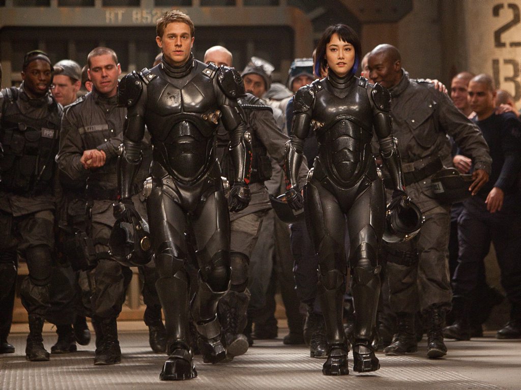 Charlie Hunnam and Rinko Kikuchi in a scene from the movie Pacific Rim. Charlie Hunnam and Rinko Kikuchi in a scene from the movie Pacific Rim.