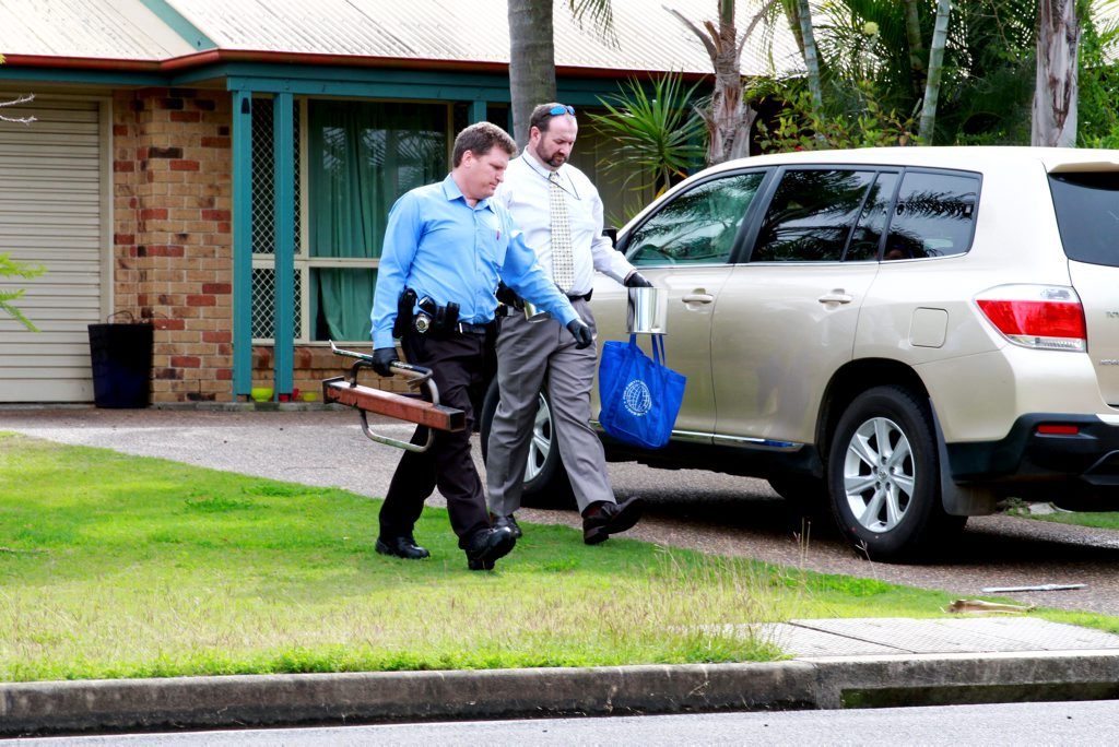 Police officers at a Garson Street home where the police allegedly uncovered a drug lab. Police officers at a Garson Street home where the police allegedly uncovered a drug lab.