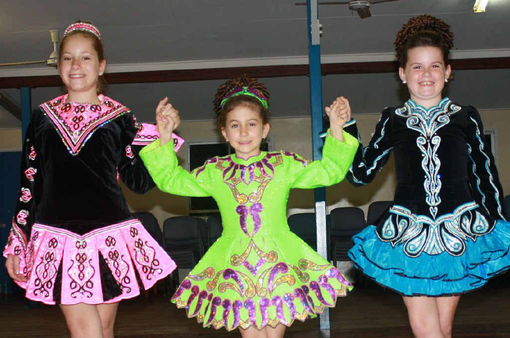 MERRY BUNCH: PCYC Irish dancers Erin Murphy, Piper McDade and Olivia Tudman dressed in their competition solo dresses following the north Queensland Premierships in June 2013. MERRY BUNCH: PCYC Irish dancers Erin Murphy, Piper McDade and Olivia Tudman dressed in their competition solo dresses following the north Queensland Premierships in June 2013.