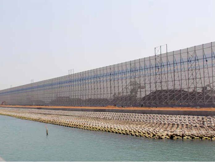 A Brisbane business man wants government to come to the table and support a giant coal dust containment system, similar to this one in Southern China, which he says will reduce coal dust dispersal by 80%.