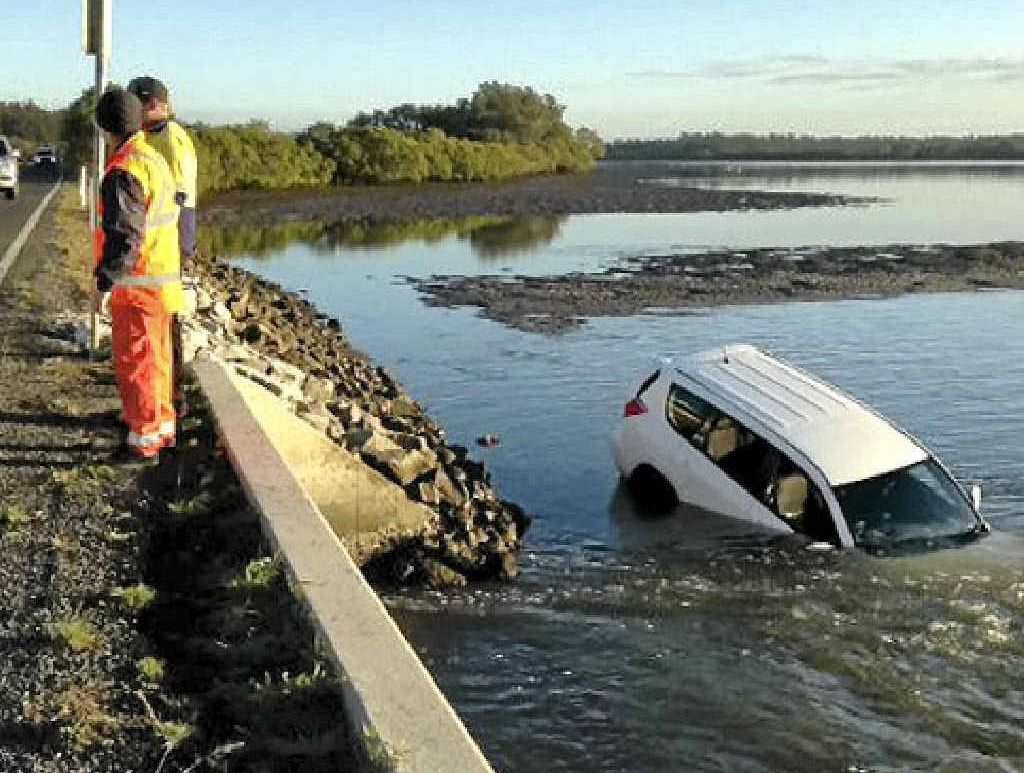 IN THE DRINK: A white RAV4 in the water in Shallow Channel, near Yamba on Saturday. IN THE DRINK: A white RAV4 in the water in Shallow Channel, near Yamba on Saturday.