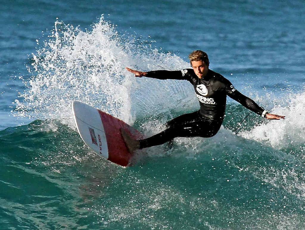 FOR HIS COAST OF ORIGIN: Nic Jones heads for victory in the open men’s longboard divison yesterday.