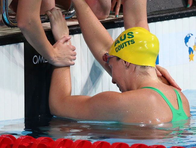 Alicia Coutts of Australia is consoled by teammates after the Swimming Women's 4x100m Freestyle on day nine of the 15th FINA World Championships Alicia Coutts of Australia is consoled by teammates after the Swimming Women's 4x100m Freestyle on day nine of the 15th FINA World Championships