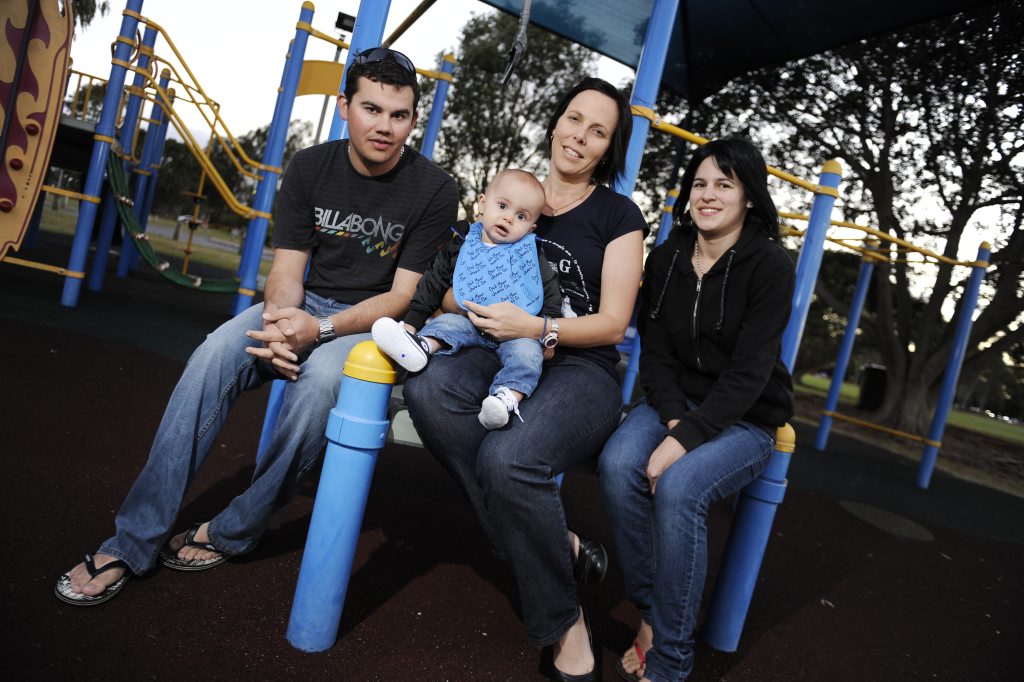 Image for sale: Twelve-month-old Tyler Batterham's dad Dean Batterham, aunt Michelle Kiss and mother Chantelle Davies support Jeans for Genes Day.