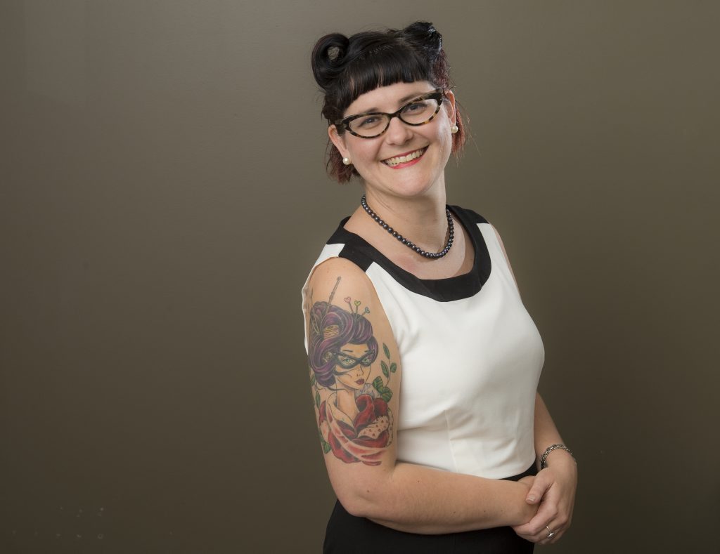 Lisa McPhee shows off her arm tattoo.