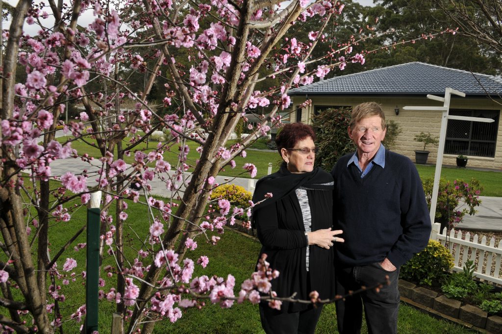 Dianna and Kevin Drew with a flowering plum tree. Dianna and Kevin Drew with a flowering plum tree.