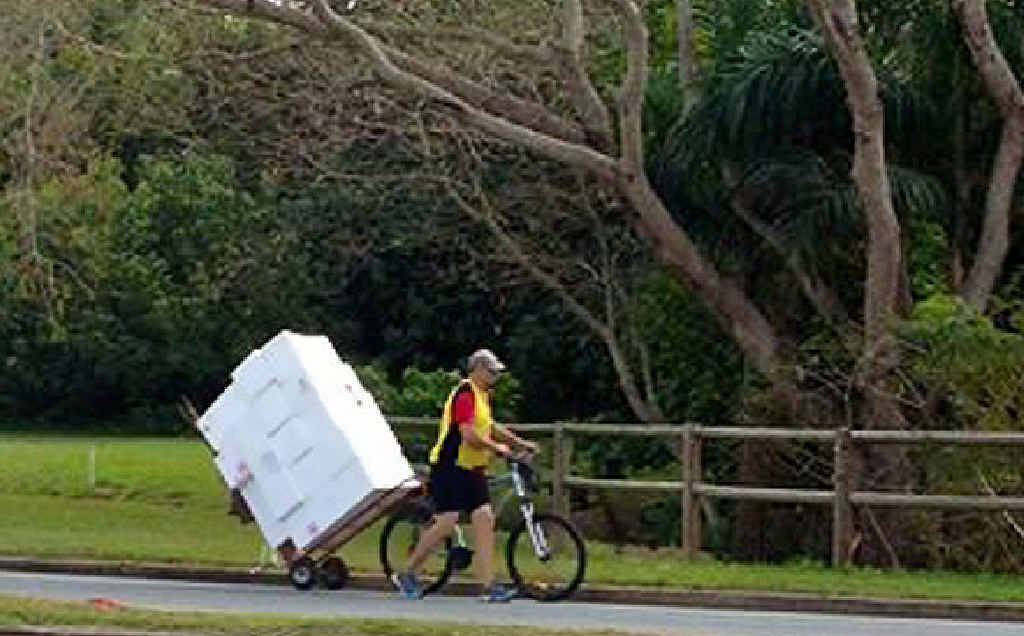 Mackay’s mystery bike rider has been snapped again, this time balancing about 20 boxes on the back of his bike. Mackay’s mystery bike rider has been snapped again, this time balancing about 20 boxes on the back of his bike.