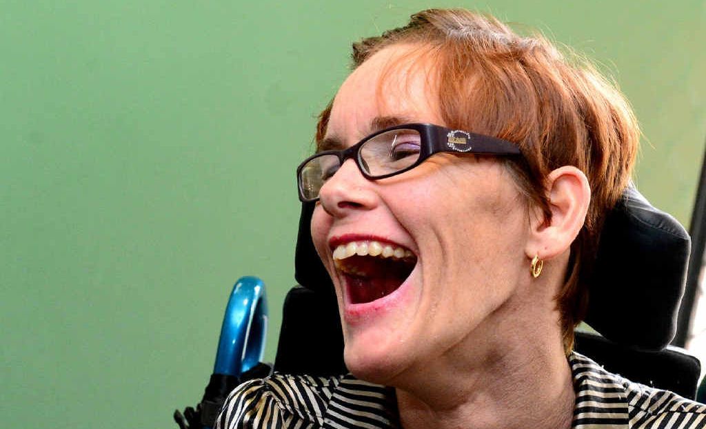Helena Kidd lives an independent life despite cerebral palsy. She communicates with a board, pointing out letters and words with her toes. Helena Kidd lives an independent life despite cerebral palsy. She communicates with a board, pointing out letters and words with her toes.