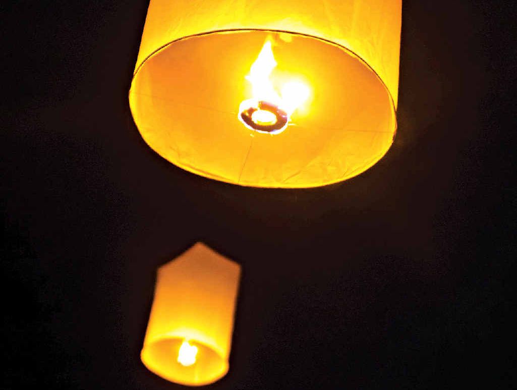 Flying lanterns fill the sky at the Loi Krathong festival. Flying lanterns fill the sky at the Loi Krathong festival.