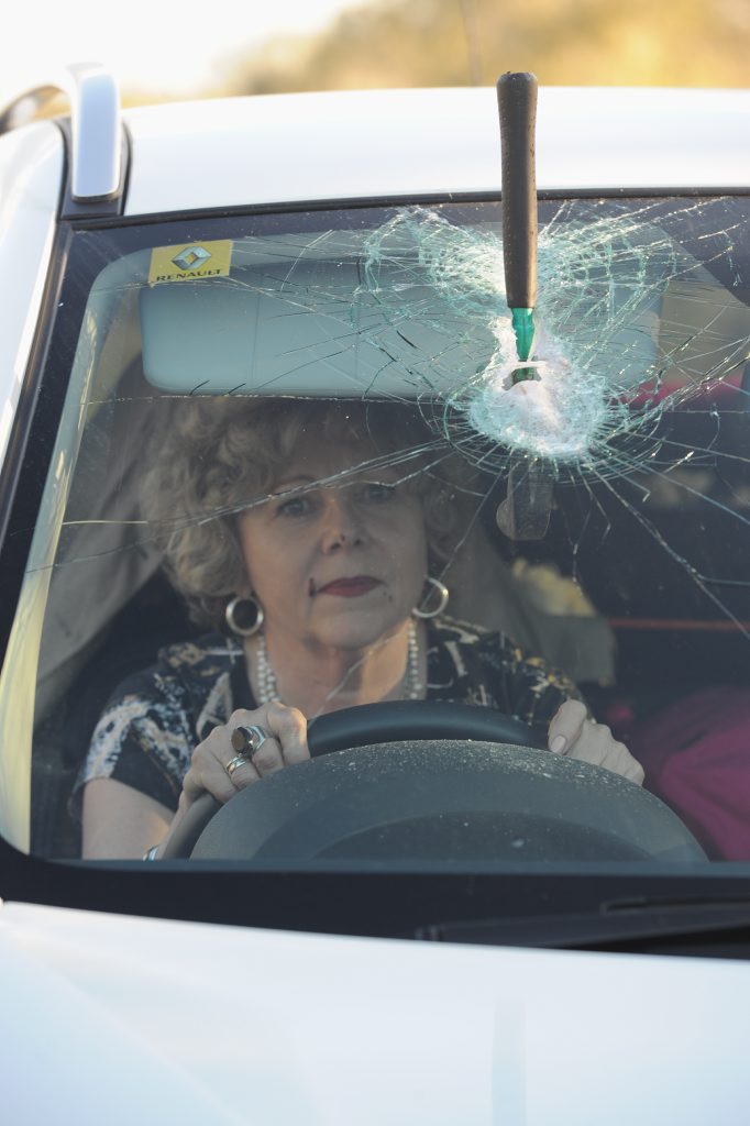 Burrum Heads resident Georgina Hrabe with the hammer that came off a truck and became embedded in her windscreen. Burrum Heads resident Georgina Hrabe with the hammer that came off a truck and became embedded in her windscreen.