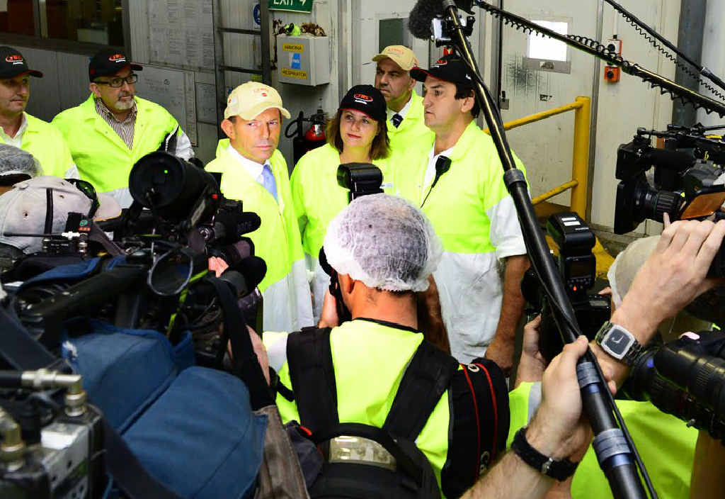 MEATWORKS MEETING: Opposition Leader Tony Abbott faces the press pack at JBS Australia’s processing plant at Dinmore yesterday alongside LNP candidate for Blair Teresa Harding and shadow treasurer Joe Hockey (rear). MEATWORKS MEETING: Opposition Leader Tony Abbott faces the press pack at JBS Australia’s processing plant at Dinmore yesterday alongside LNP candidate for Blair Teresa Harding and shadow treasurer Joe Hockey (rear).