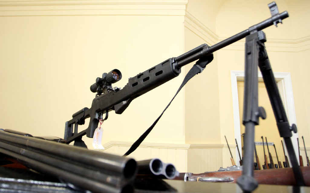 FIRING LINE: This rifle was among 150 weapons seized. FIRING LINE: This rifle was among 150 weapons seized.