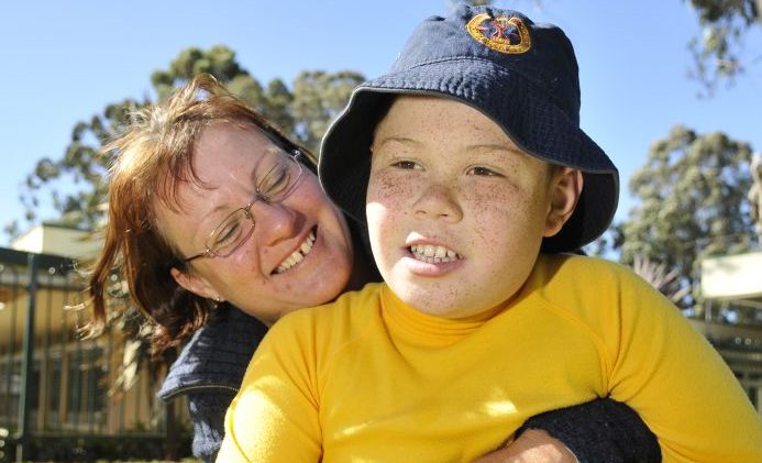 Jenny Jerome hugs her son Sam at Toowoomba West Special School. Jenny Jerome hugs her son Sam at Toowoomba West Special School.