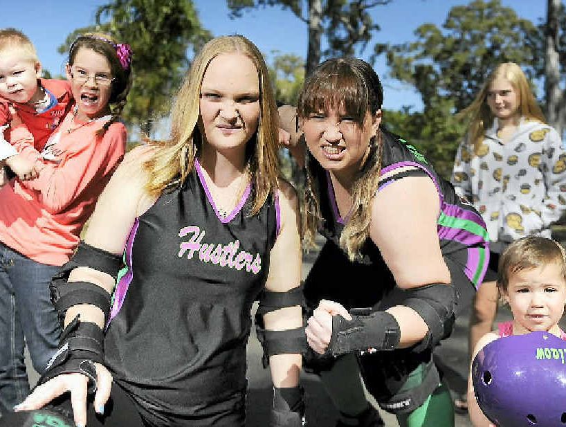READY TO RUMBLE: Roller derby super mums Cassie Williams (Casstr8r) and Ellie Picking (Kittie Miaow) with Zeke Williams, 1, Teniel Williams, 12, Sienna Picking, 1, and Chloe Stuart, 12. READY TO RUMBLE: Roller derby super mums Cassie Williams (Casstr8r) and Ellie Picking (Kittie Miaow) with Zeke Williams, 1, Teniel Williams, 12, Sienna Picking, 1, and Chloe Stuart, 12.