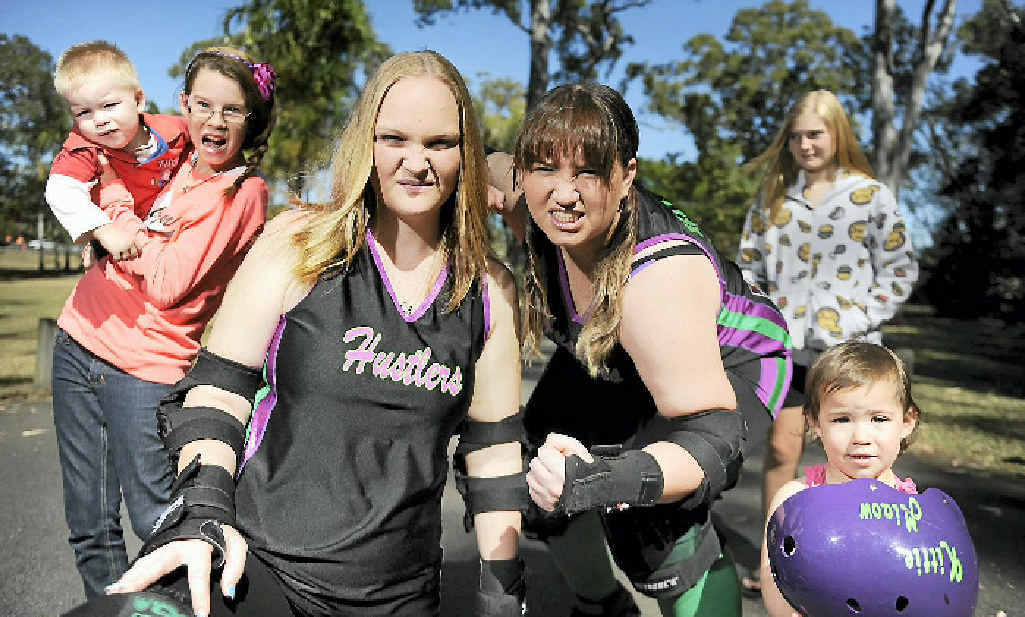 READY TO RUMBLE: Roller derby super mums Cassie Williams (Casstr8r) and Ellie Picking (Kittie Miaow) with Zeke Williams, 1, Teniel Williams, 12, Sienna Picking, 1, and Chloe Stuart, 12. READY TO RUMBLE: Roller derby super mums Cassie Williams (Casstr8r) and Ellie Picking (Kittie Miaow) with Zeke Williams, 1, Teniel Williams, 12, Sienna Picking, 1, and Chloe Stuart, 12.