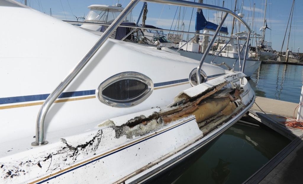 This boat was damaged when a whale breached and landed on top of it near Fraser Island. This boat was damaged when a whale breached and landed on top of it near Fraser Island.