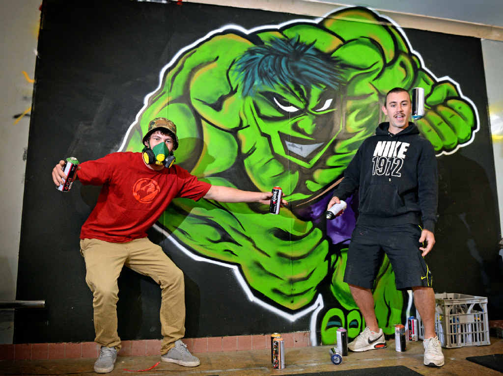 EMBLAZONED: Graffiti writers Joey Joyce and Lindon Vickers with their Incredible Hulk graffiti at Tweed Heads Seagulls club rooms. EMBLAZONED: Graffiti writers Joey Joyce and Lindon Vickers with their Incredible Hulk graffiti at Tweed Heads Seagulls club rooms.