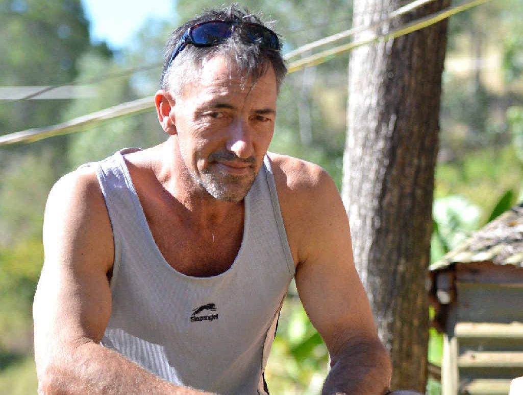 Barry Digman sits on the yogurt containers that held his mate Spike’s favourite food. Barry Digman sits on the yogurt containers that held his mate Spike’s favourite food.