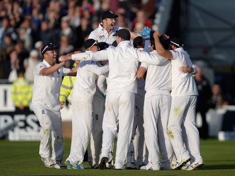 The English players celebrate their Ashes victory. The English players celebrate their Ashes victory.