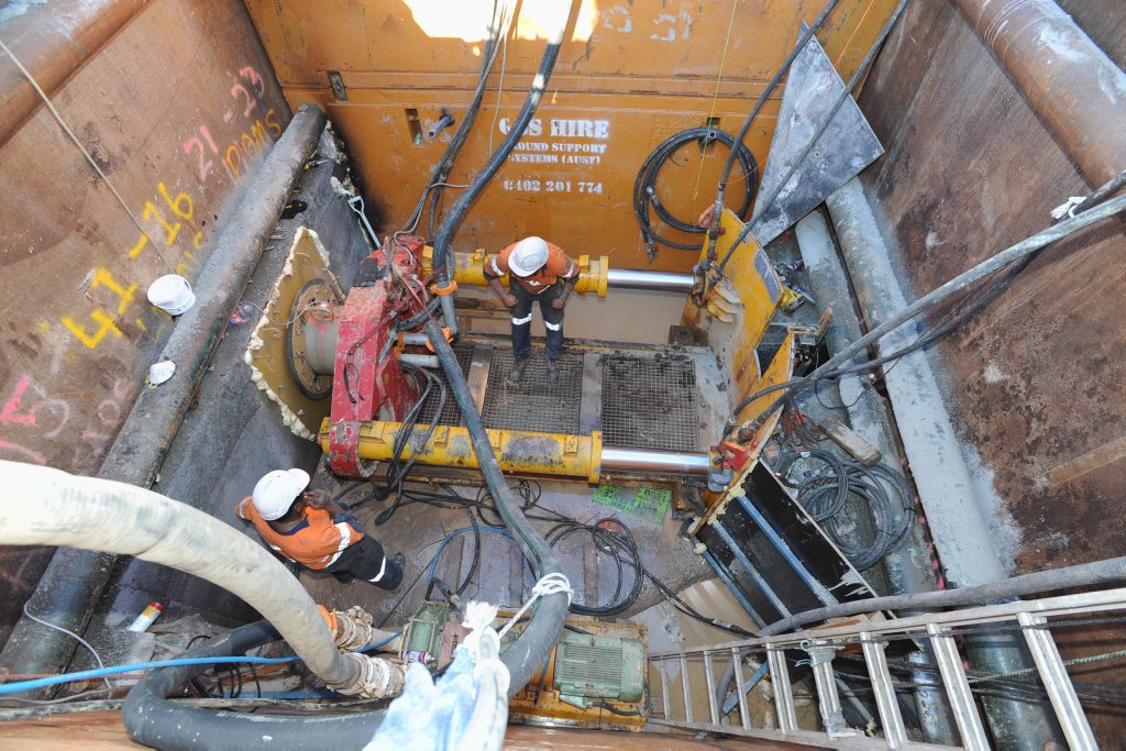 Workers installing pipes at Pialba using micro tunnelling for a new sewerage line. Workers installing pipes at Pialba using micro tunnelling for a new sewerage line.
