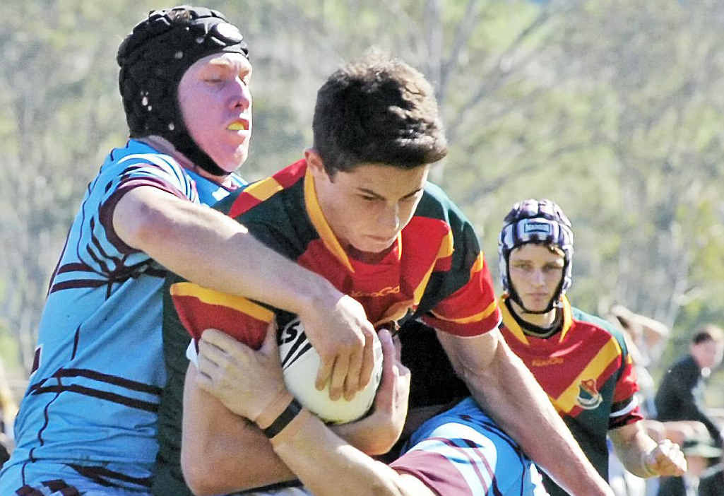 WRAPPED UP: Woodlawn College’s Nick Meaney is tackled by an opponent during his side’s Combined Catholic Colleges Cup match. WRAPPED UP: Woodlawn College’s Nick Meaney is tackled by an opponent during his side’s Combined Catholic Colleges Cup match.