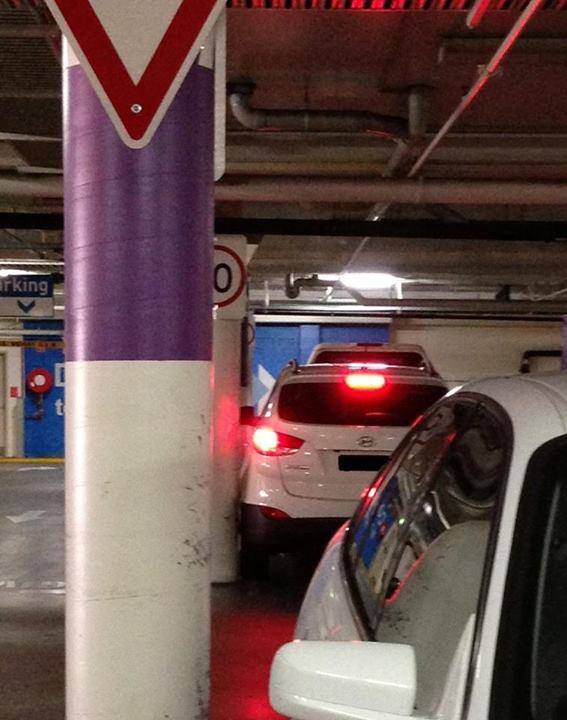 This motorist gets a little too close to the nearby pole. This motorist gets a little too close to the nearby pole.