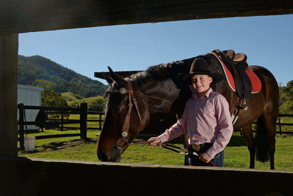 Young horseman Carter McHugh with Harley the thoroughbred. Young horseman Carter McHugh with Harley the thoroughbred.