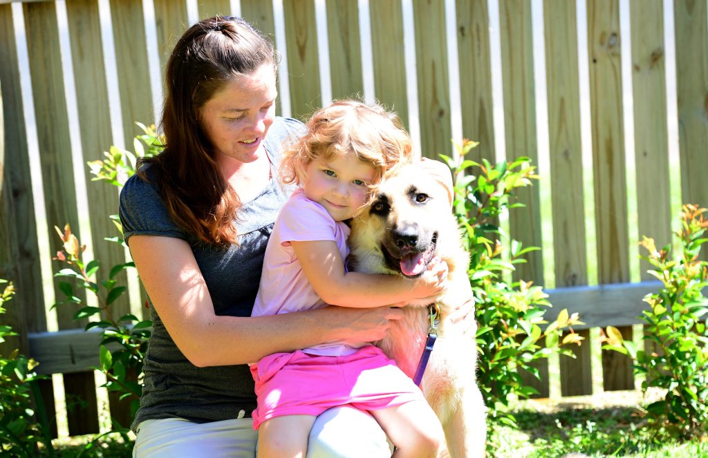 Nikki Bella with her daughter, age 3, with Merlin the dog. Photo Sharyn O'Neill / The Morning Bulletin Nikki Bella with her daughter, age 3, with Merlin the dog. Photo Sharyn O'Neill / The Morning Bulletin
