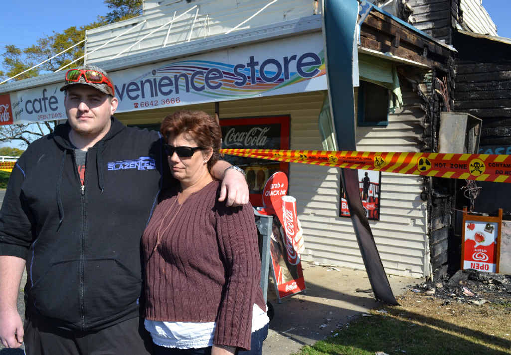 TRAUMATIC: Tim and Jody Taylor outside the burnt shop. TRAUMATIC: Tim and Jody Taylor outside the burnt shop.