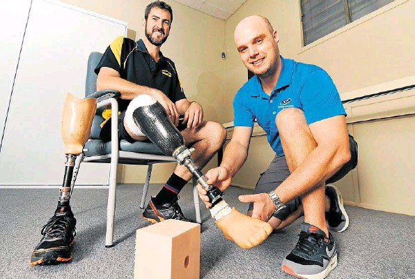 Dewet Heyns gets Marc Burton’s prosthetic leg ready for this weekend’s Tough Mudder. Dewet Heyns gets Marc Burton’s prosthetic leg ready for this weekend’s Tough Mudder.