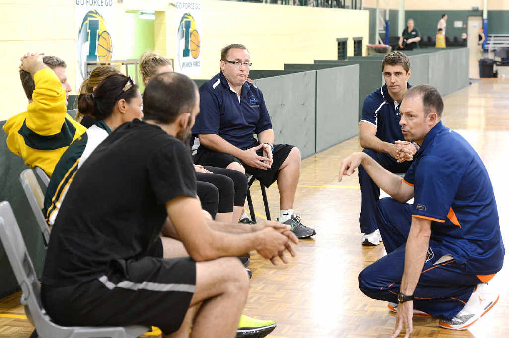 ELITE ADVICE: Cairns Taipans head coach Aaron Fearn (right) and St Mary’s assistant coach Adam Caporn (back right) work with Ipswich coaches at yesterday’s clinic at Booval. ELITE ADVICE: Cairns Taipans head coach Aaron Fearn (right) and St Mary’s assistant coach Adam Caporn (back right) work with Ipswich coaches at yesterday’s clinic at Booval.