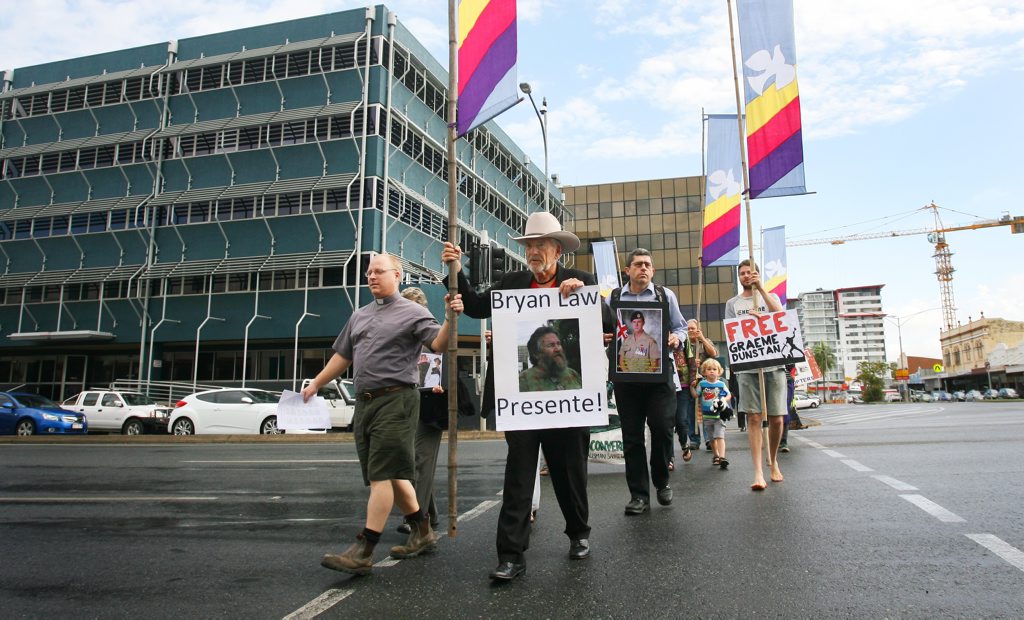 Graeme Dunstan and supporters march to the Rockhampton Court where he faces charges stemming from damage to a heicopter during Exercise Talisman Sabre 2011. Photo: Chris Ison / The Morning Bulletin Graeme Dunstan and supporters march to the Rockhampton Court where he faces charges stemming from damage to a heicopter during Exercise Talisman Sabre 2011. Photo: Chris Ison / The Morning Bulletin