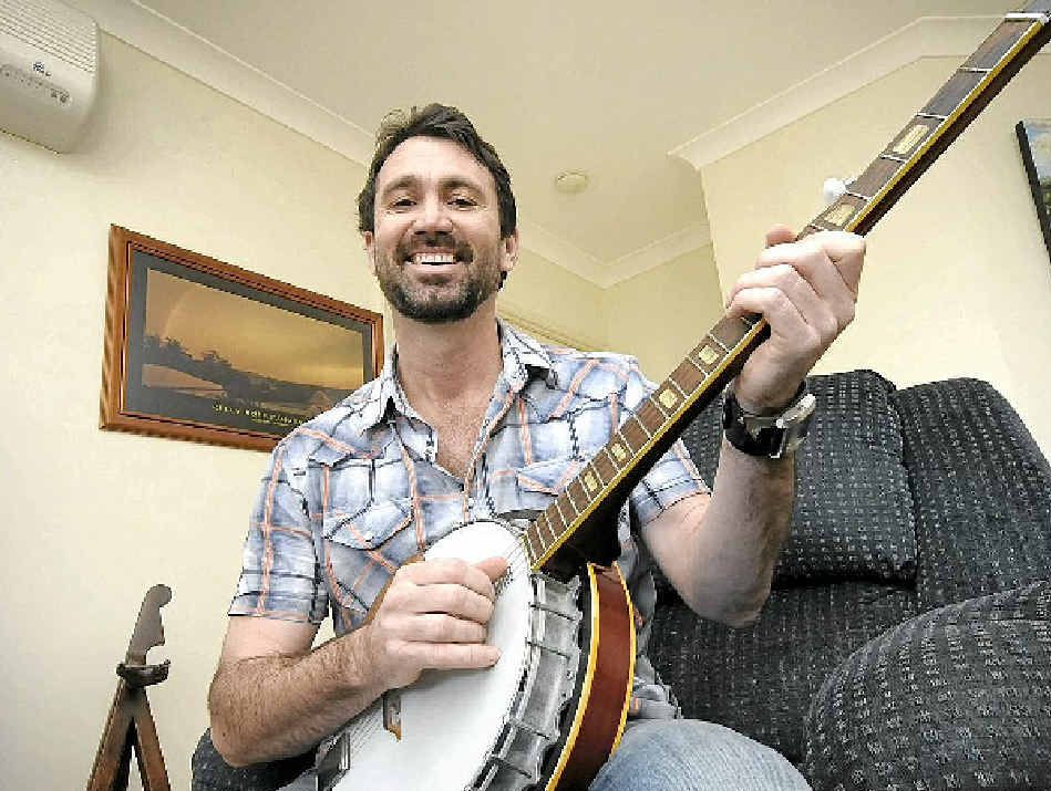 Jake Roff of Alstonville is a finalist in the country section of this year’s Dolphin Awards with The Crocodiles Are Crying and Gibson The Gorilla in the children’s song section. Inset is Steve Irwin feeding a croc at Australia Zoo. Jake Roff of Alstonville is a finalist in the country section of this year’s Dolphin Awards with The Crocodiles Are Crying and Gibson The Gorilla in the children’s song section. Inset is Steve Irwin feeding a croc at Australia Zoo.
