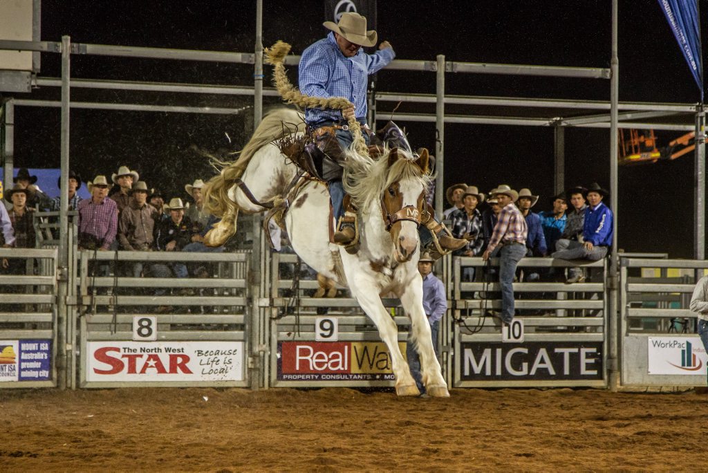 Saddle bronc riding at the Mount Isa Mines Rotary Rodeo. Credit: Ben MacRae Saddle bronc riding at the Mount Isa Mines Rotary Rodeo. Credit: Ben MacRae
