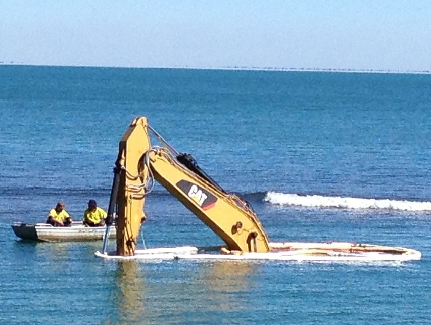 The excavator at Gatakers Bay is underwater on Wednesday morning. The excavator at Gatakers Bay is underwater on Wednesday morning.