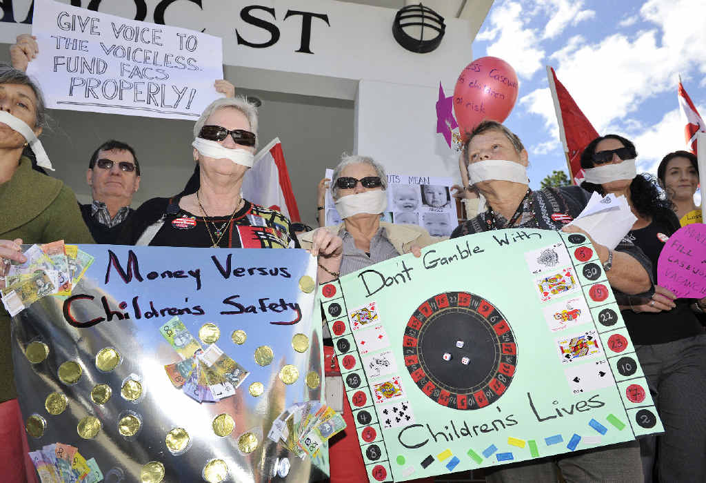 GAGGED: Child protection case workers in Lismore, on strike for an hour to highlight the lack of staff and resources. GAGGED: Child protection case workers in Lismore, on strike for an hour to highlight the lack of staff and resources.